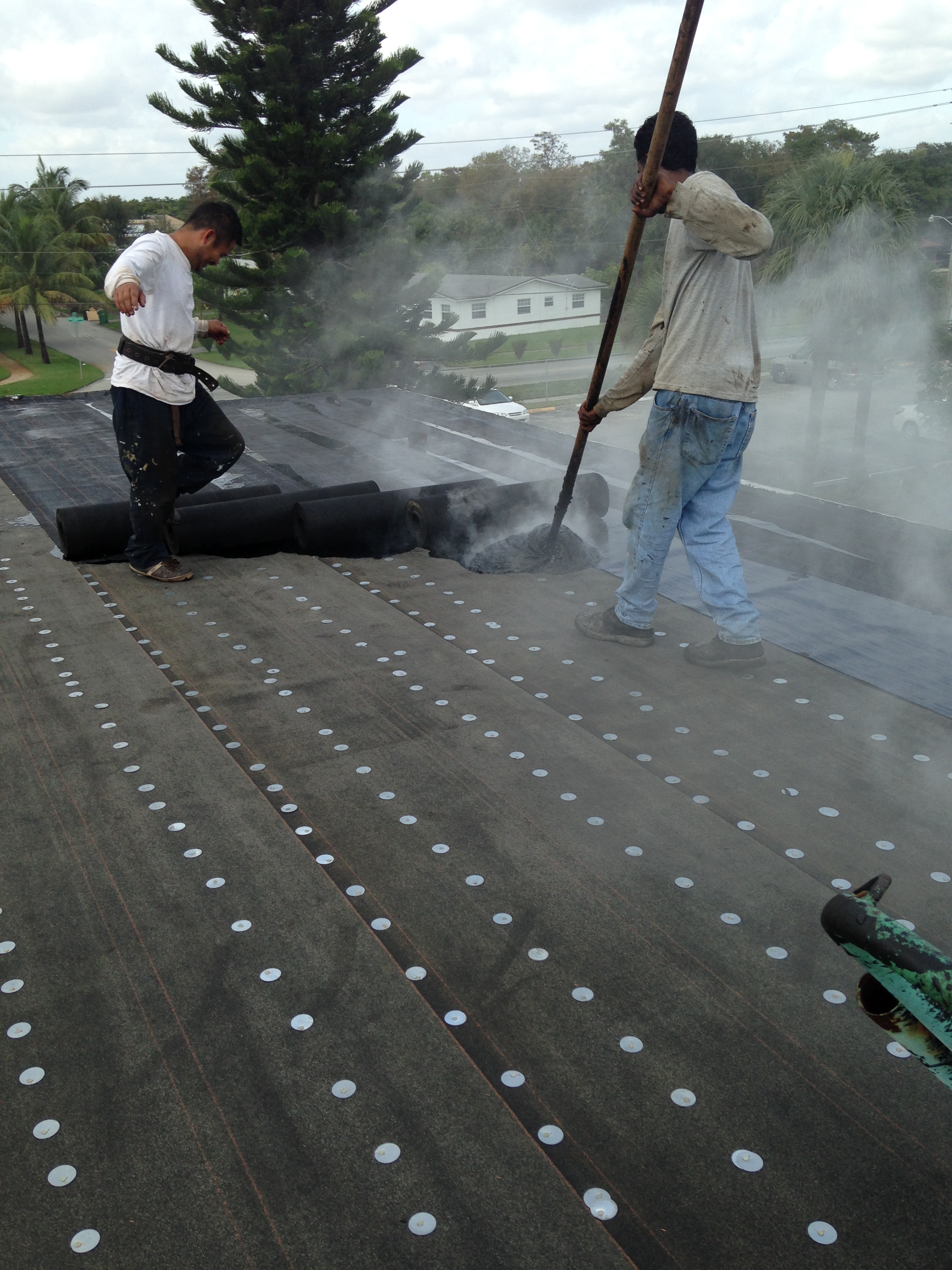 Hot mop on conventional flat roof commecrial roofing